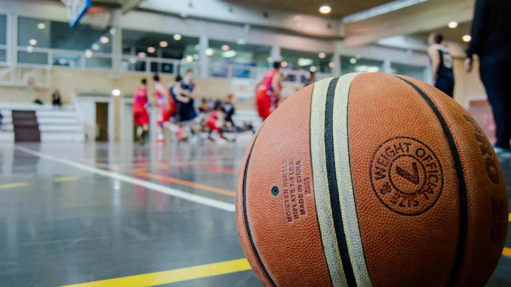 Captivating indoor basketball scene with players actively engaged in a game.