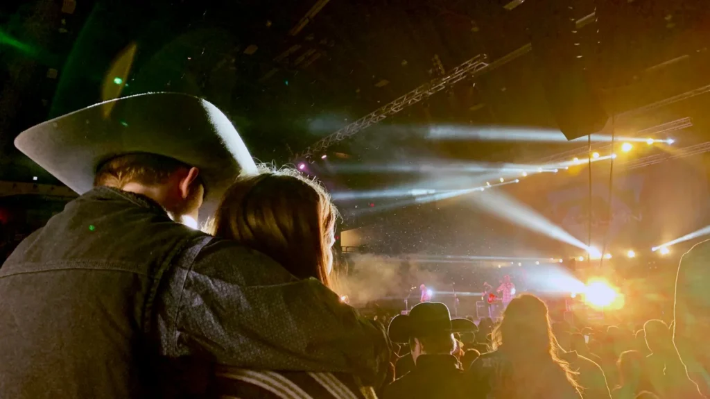 Couple enjoying a vibrant live country music concert at CMA Fest 2026 in Nashville