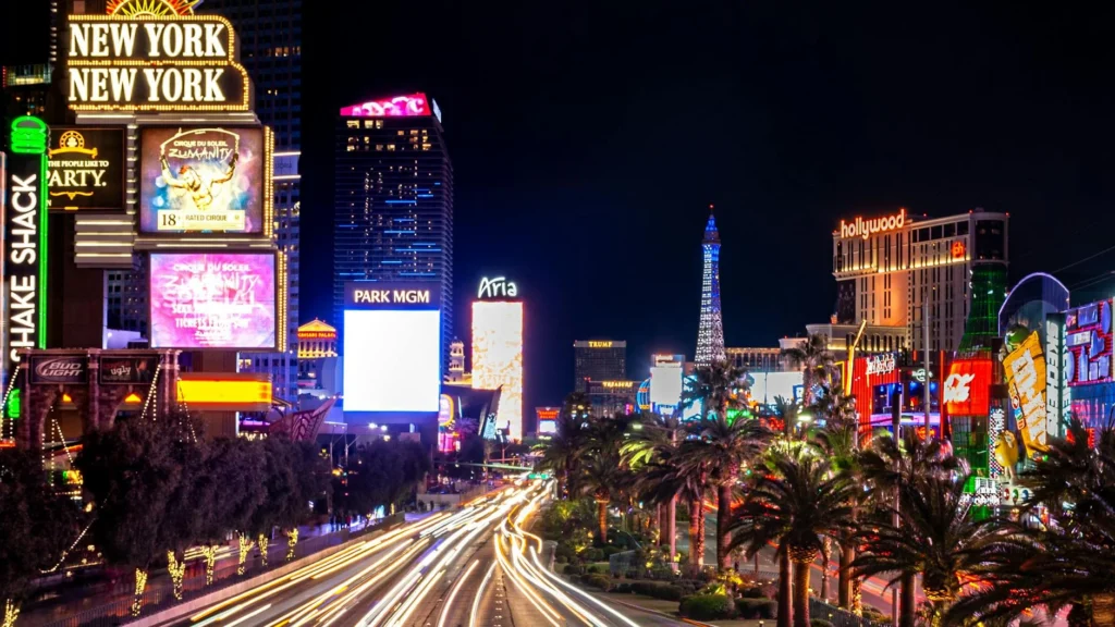 Experience the vibrant neon lights and nightlife of the iconic Las Vegas Strip at night.