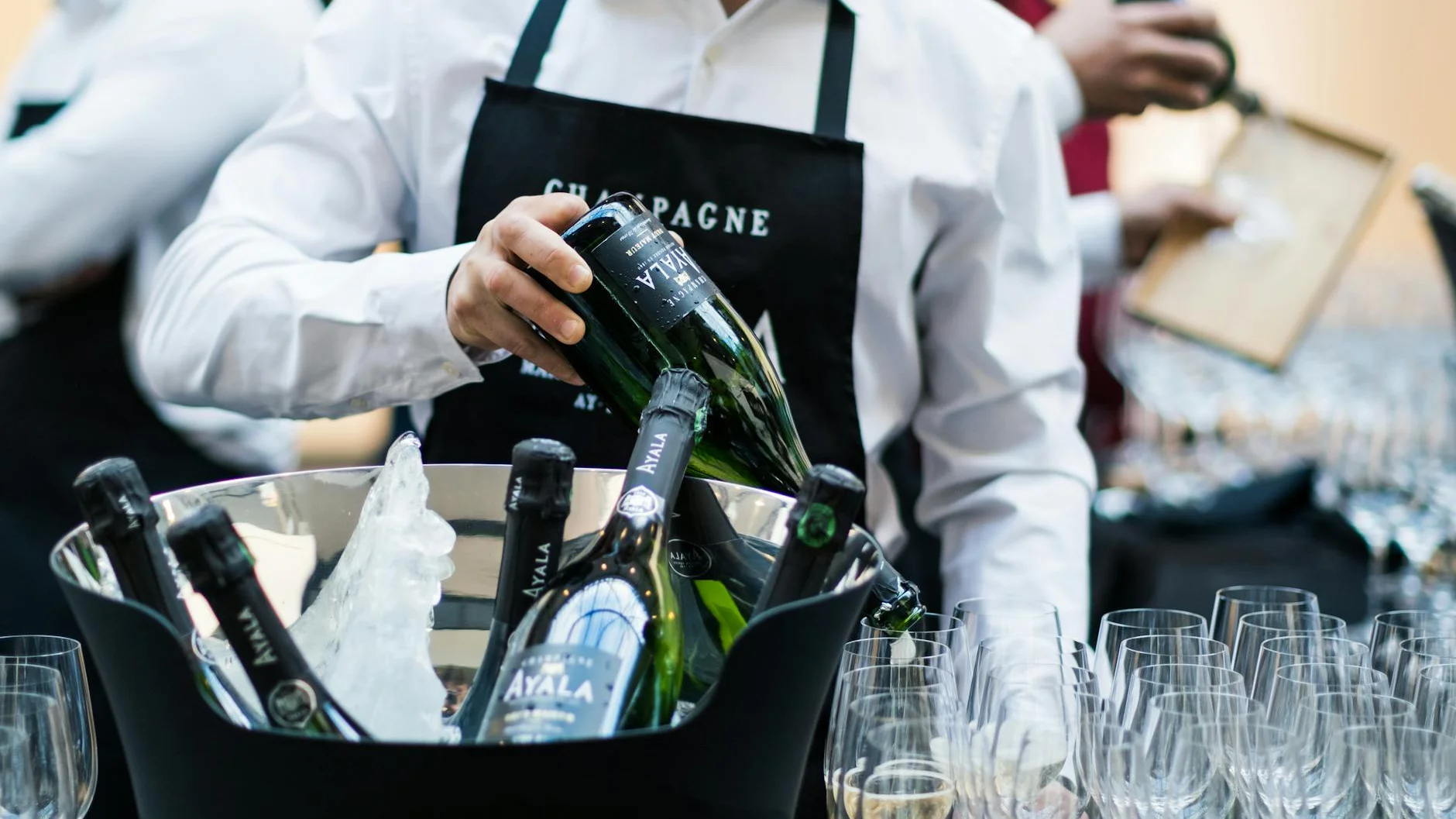 Champagne service at a VIP hospitality event representing the luxury Breeders Cup experience