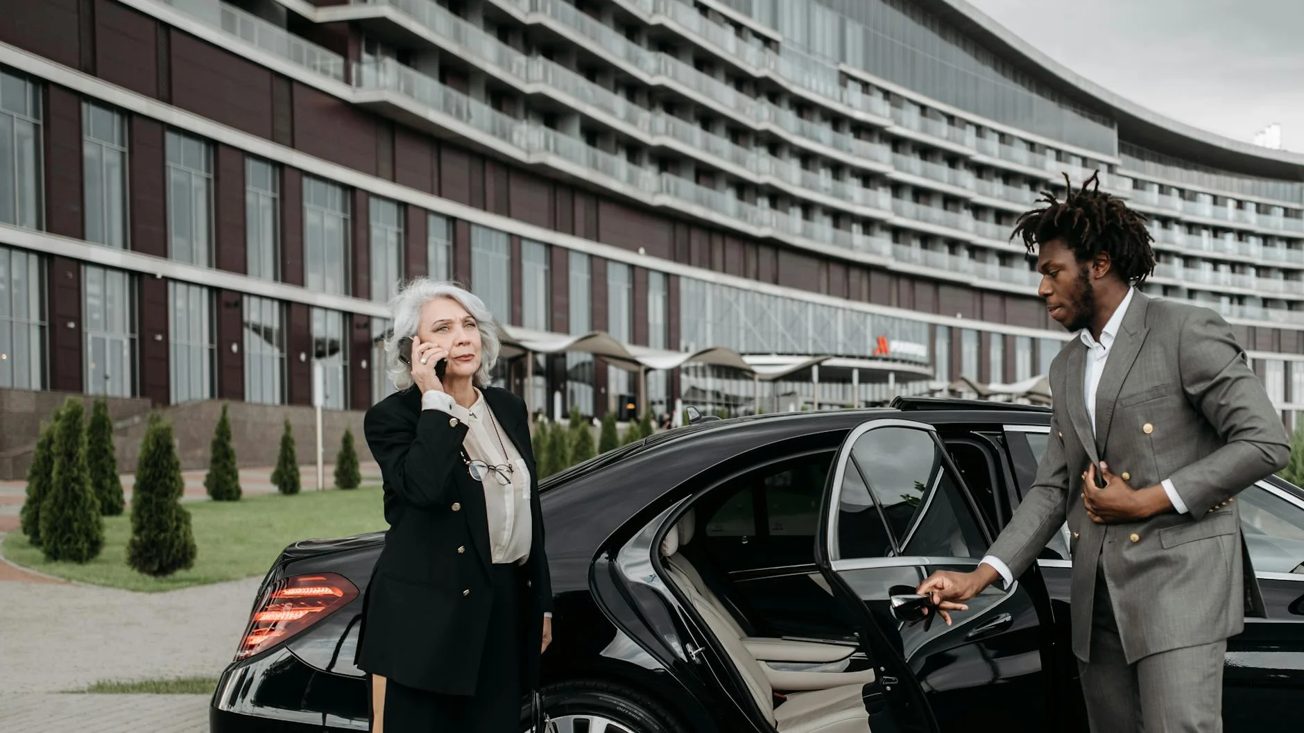 Chauffeur providing secure executive transportation for business professional