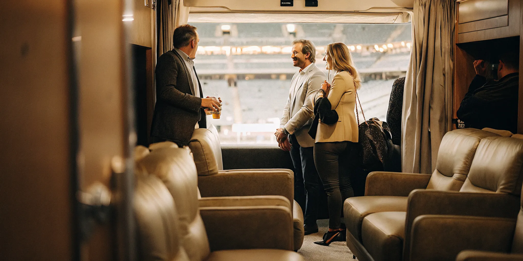 Executive hosting clients in a private suite while practicing client hosting etiquette