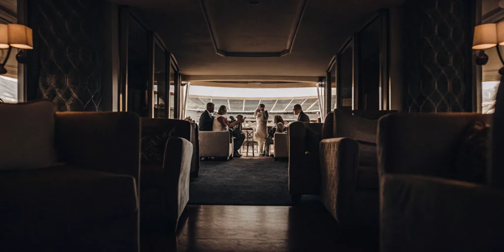Corporate guests enjoying a premium private stadium suite