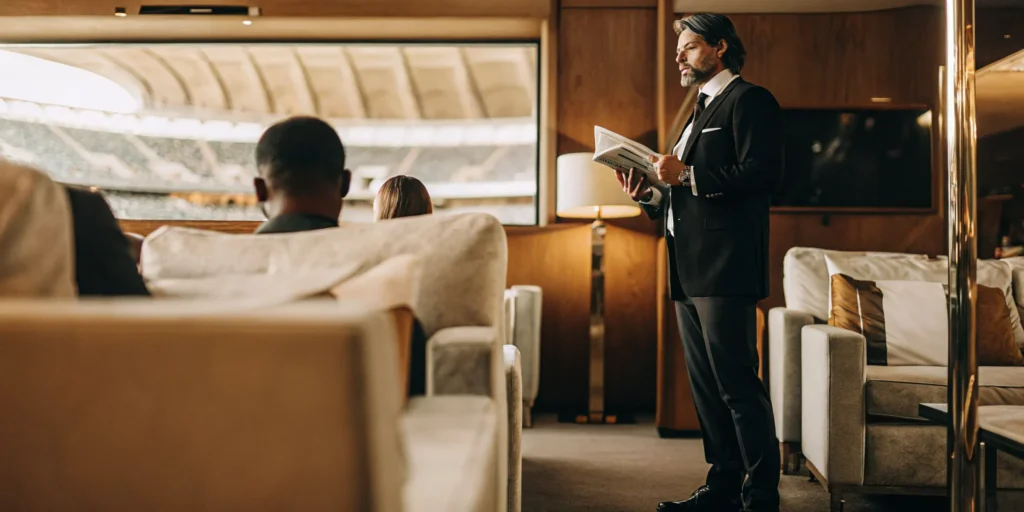 Executive planning a corporate VIP sports travel itinerary